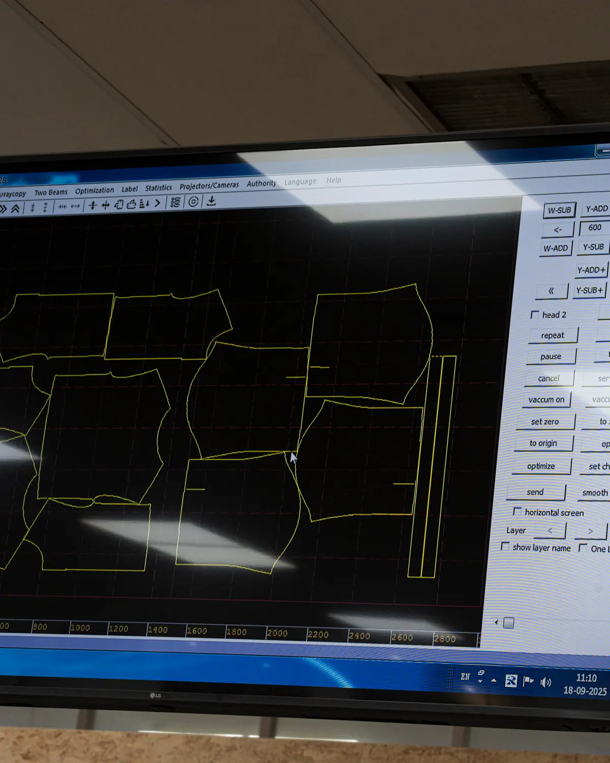 Pattern pieces laid out on a CAD screen in a development room
